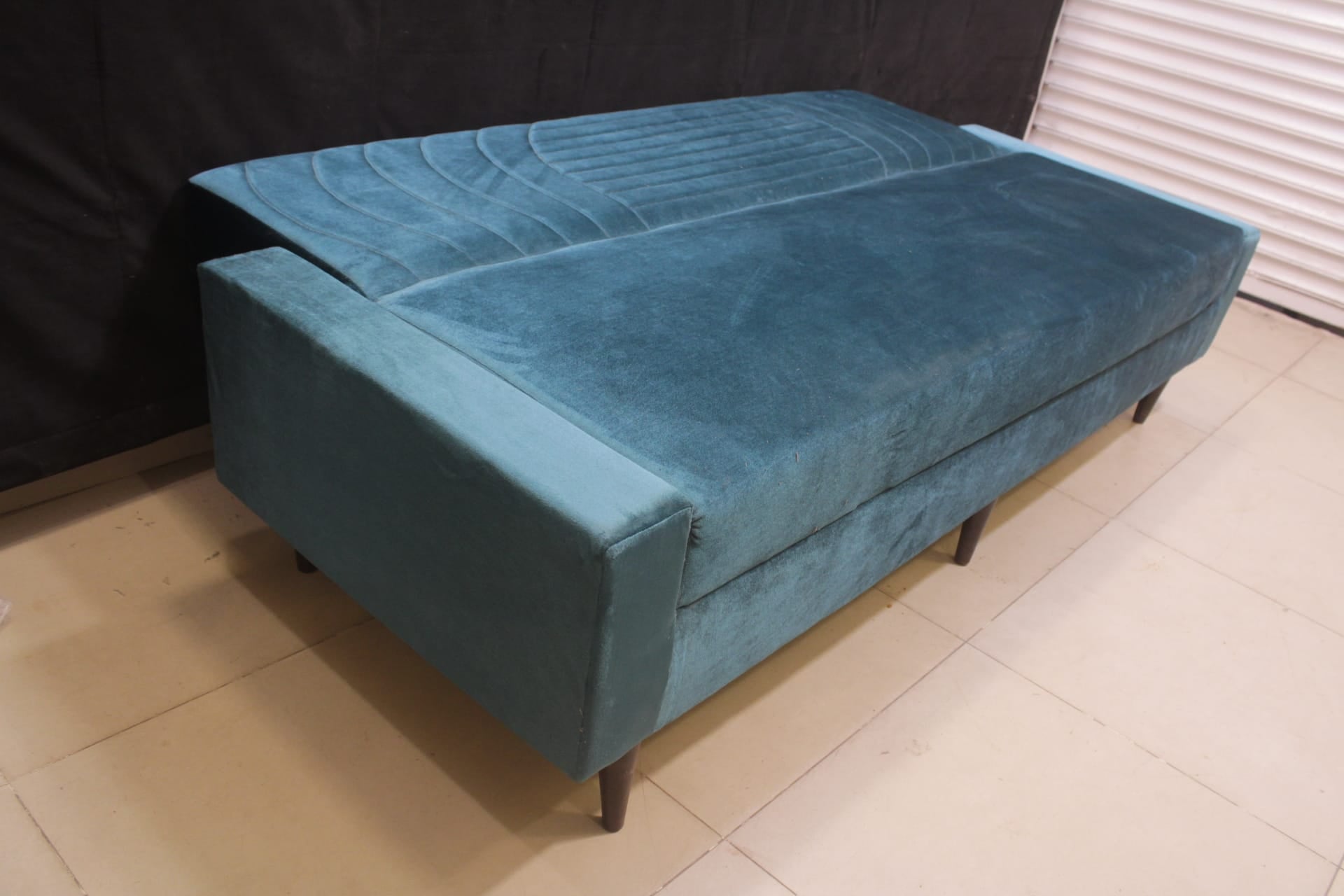 Sofa Cum Bed Upholstered in Premium Velvet Fabric With An Easy Pull-out Mechanism.