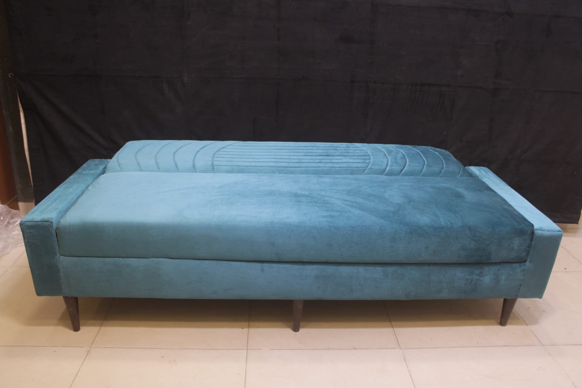 Sofa Cum Bed Upholstered in Premium Velvet Fabric With An Easy Pull-out Mechanism.
