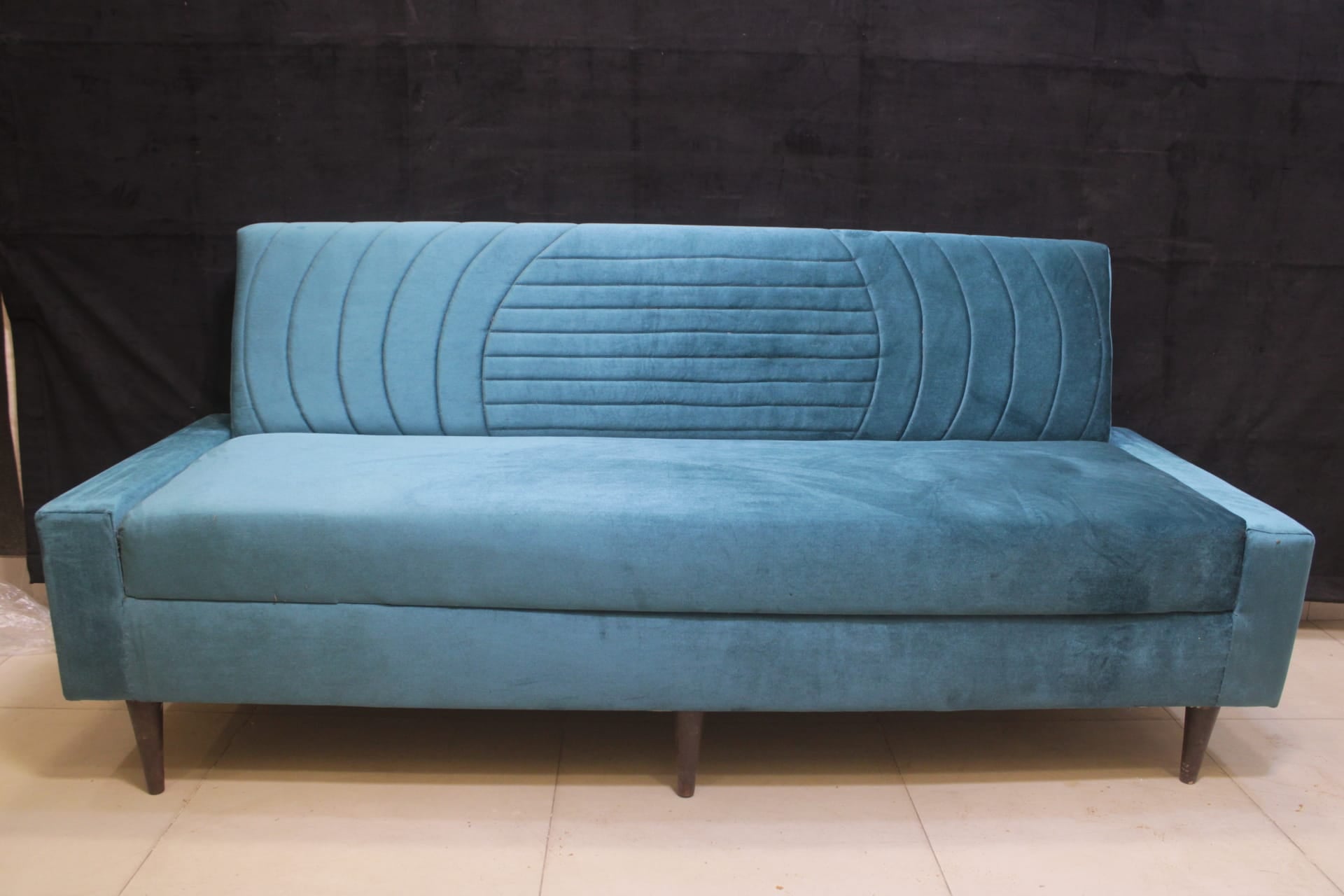 Sofa Cum Bed Upholstered in Premium Velvet Fabric With An Easy Pull-out Mechanism.